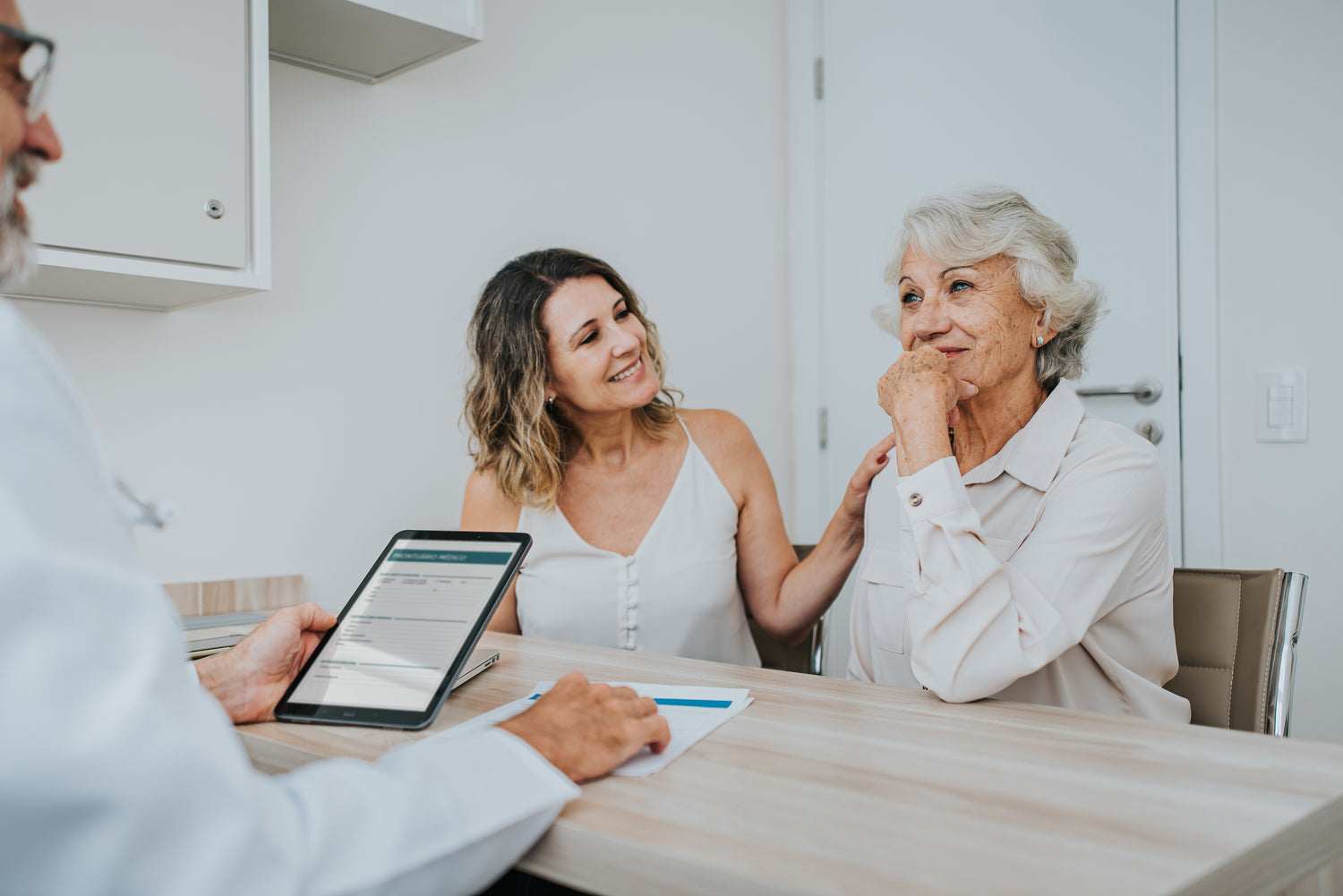 Image of mother an daughter and Doctor appointment.  Both mother and daughter are pleased as her hepatic encephalopathy symptoms have improved dramatically from HepLOLA without the GI side effects and loose stools found with lactulose and the expense with rifaximin